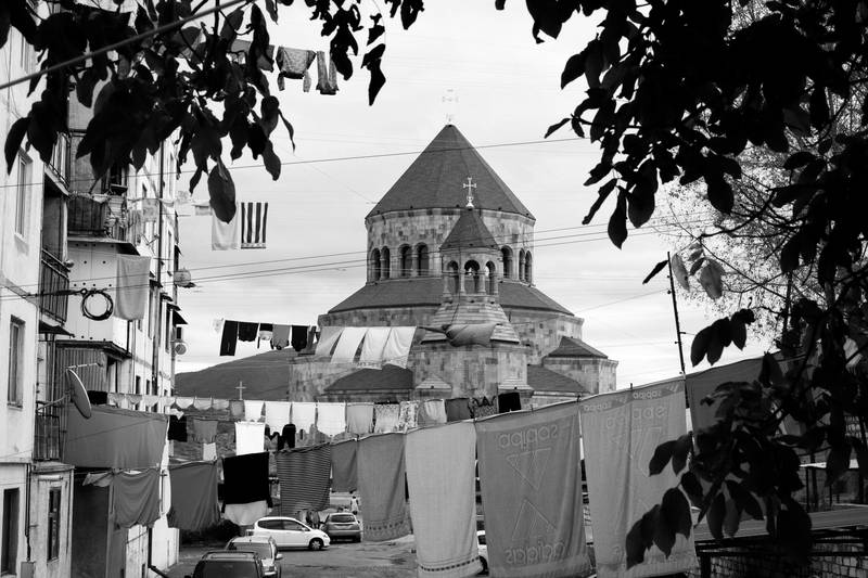 Lines of laundry in one of Stepanakert’s neighborhoods with the Holy Mother of God Cathedral in the background. 2019