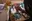 Waleed Mohammed painting from his bed