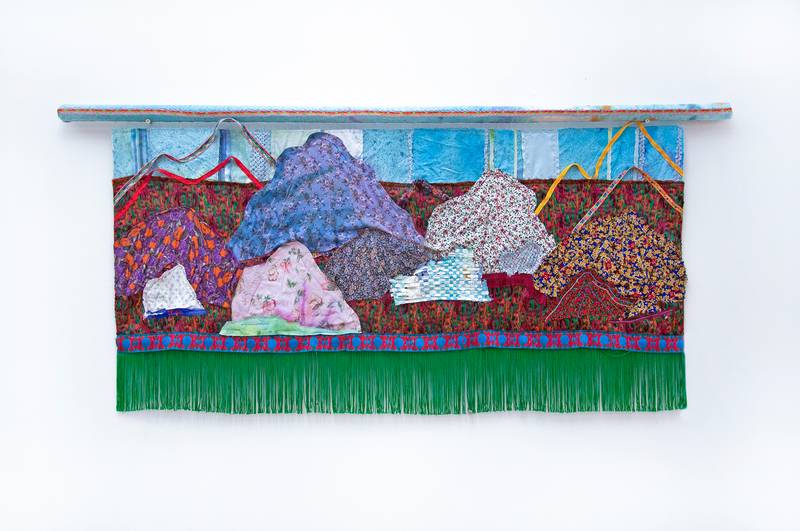 All I remember (front), 2022, hand-dyed cloth, handwoven Persian textile (Termeh), mail receipt, found fabric, ribbon, fringe, wood bar, 25 x 56 in, double side painting