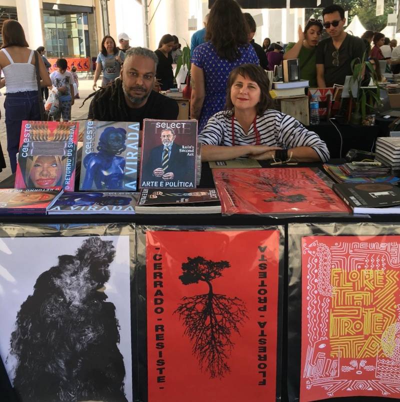 Artist Helô Sanvoy, author of the poster 'Floresta Protesta / Cerrado Resiste', edited by Paula Alzugaray, at A Feira do Livro bookfair, São Paulo, 2023
