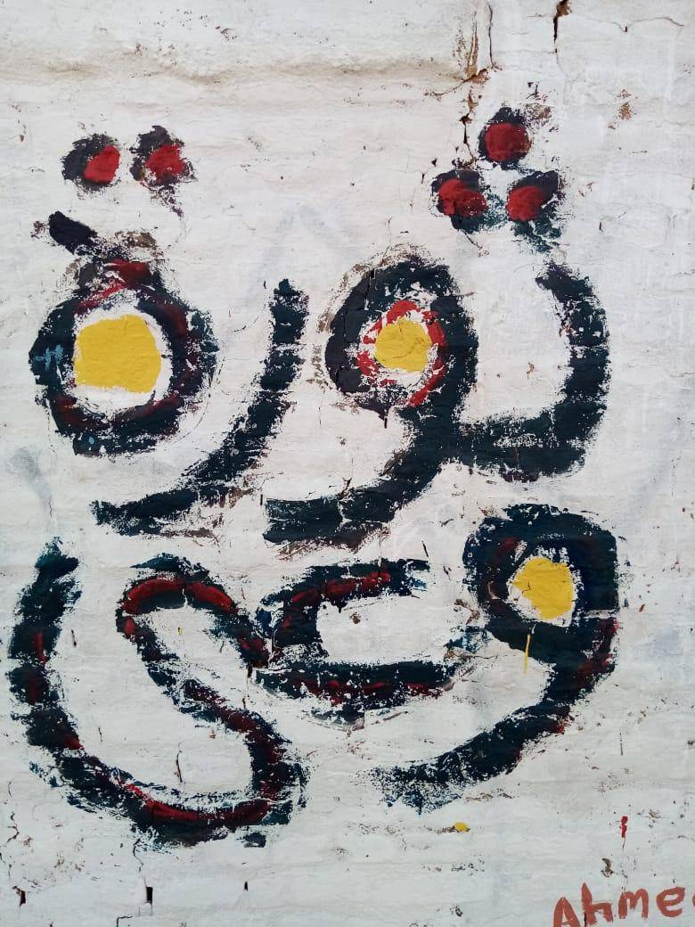 A mural in Khartoum painted by artist Issam Hafiez in 2019. It translates to “A Revolution of Awareness / Knowledge”