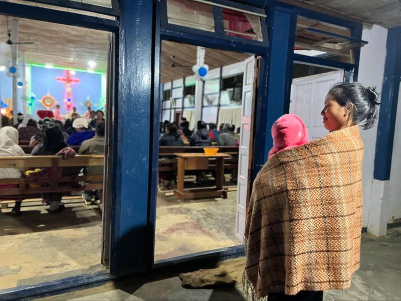 A mother and child take a break from prayer service at a church in Saikul, organised on Christmas eve. There were no Christmas celebrations in the Kuki-Zo districts.