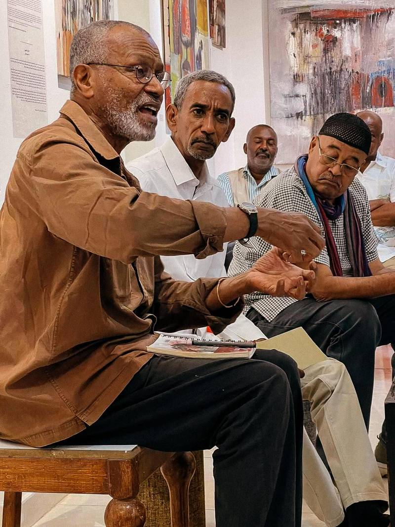 From a roundtable discussion, (left to right) Sudanese-French painter Hassan Musa, art critic Dr. Mohammed Abdelrahman Hassan, and painter Issam Hafiez. Picture taken February 2023 during Hafiez’s solo exhibition at Downtown Gallery, two months before the war. Photo: Rahiem Shadad