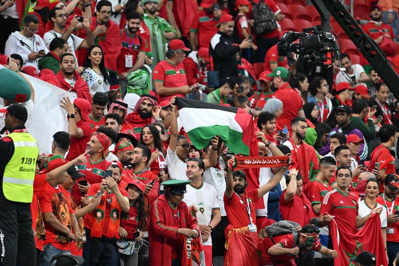 Palestine flags in action during the FIFA 2022 World Cup group match between France and Morocco, Al Bayt Stadium, Doha, 14/12/2022 Featuring: Palestine flags Where: Doha, Qatar When: 14 Dec 2022 Credit: Anthony Stanley/WENN