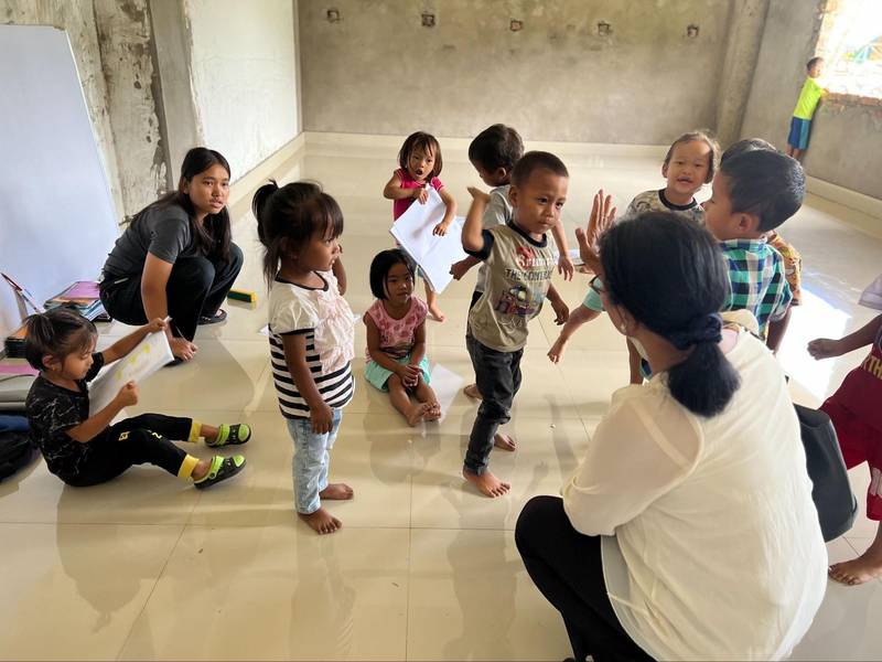 Tracy along with internally displaced students studying at the makeshift school