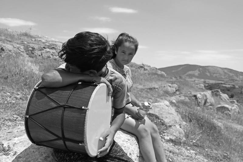 Children having a rest after playing music at Jdrduz canyon near Shushi, Artsakh. 2019. The region was occupied by azerbaijan in 2020.